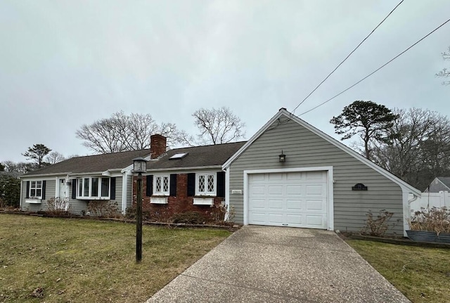 ranch-style house featuring a garage and a front lawn