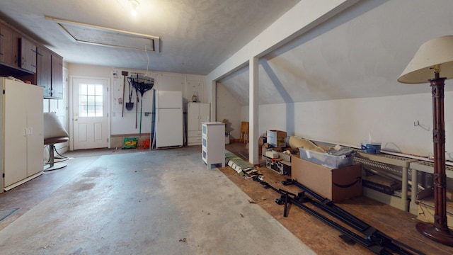 garage featuring white refrigerator