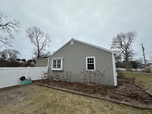 view of home's exterior with a lawn