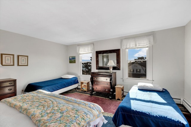 carpeted bedroom featuring baseboard heating and multiple windows