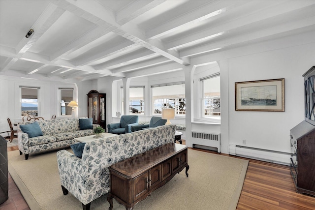 living room featuring a baseboard heating unit, dark hardwood / wood-style flooring, radiator, beam ceiling, and coffered ceiling