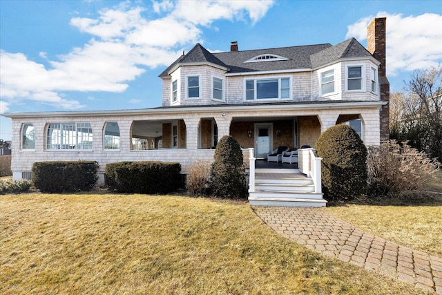 victorian house with covered porch and a front lawn