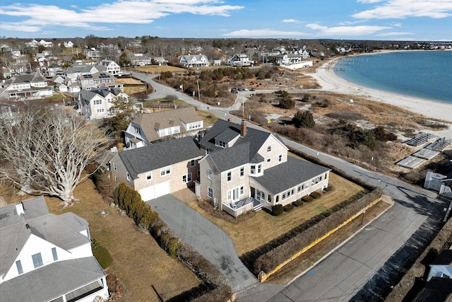 bird's eye view featuring a water view and a view of the beach