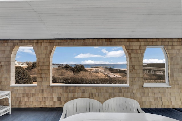 details featuring a water view and hardwood / wood-style floors