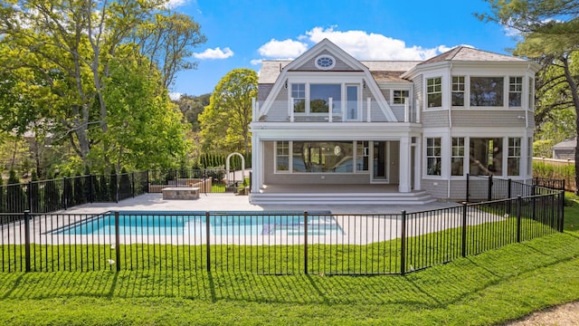64 Pershing Ln, Orleans, MA 02653 - rear view of property with a fire pit and a patio