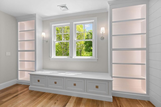 64 Pershing Ln, Orleans, MA 02653 - mudroom with light wood-type flooring, plenty of natural light, ornamental molding, and baseboards