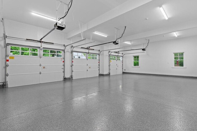 64 Pershing Ln, Orleans, MA 02653 - garage featuring a garage door opener and baseboards