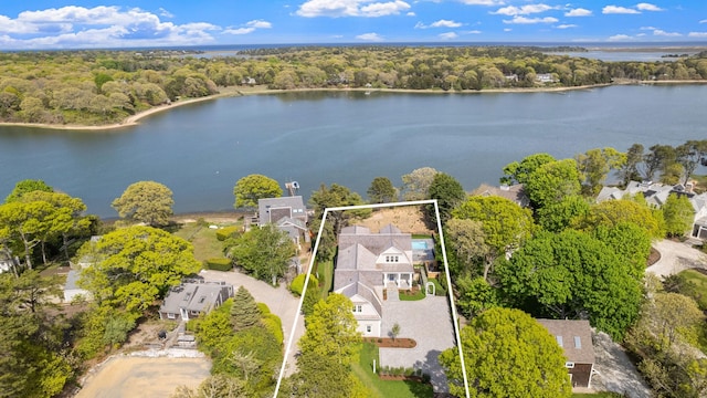 64 Pershing Ln, Orleans, MA 02653 - aerial view of property and surrounding area featuring a large body of water, property parcel outlined, and a heavily wooded area