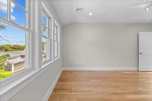 64 Pershing Ln, Orleans, MA 02653 - unfurnished room with lofted ceiling, light wood-style flooring, baseboards, recessed lighting, and a water view