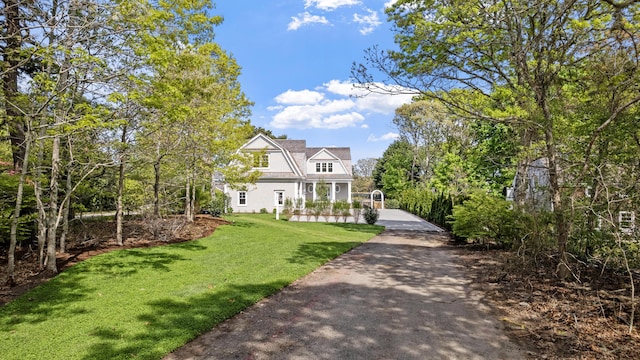 64 Pershing Ln, Orleans, MA 02653 - shingle-style home featuring a front lawn
