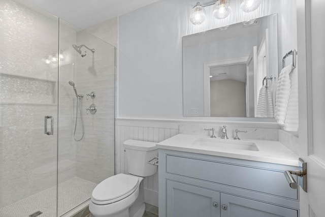 64 Pershing Ln, Orleans, MA 02653 - full bath featuring toilet, a stall shower, vanity, and wainscoting