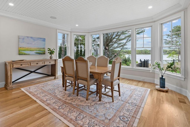 64 Pershing Ln, Orleans, MA 02653 - dining space with ornamental molding, healthy amount of natural light, baseboards, light wood-style floors, and recessed lighting