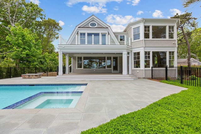 64 Pershing Ln, Orleans, MA 02653 - back of house with a patio and a pool with connected hot tub