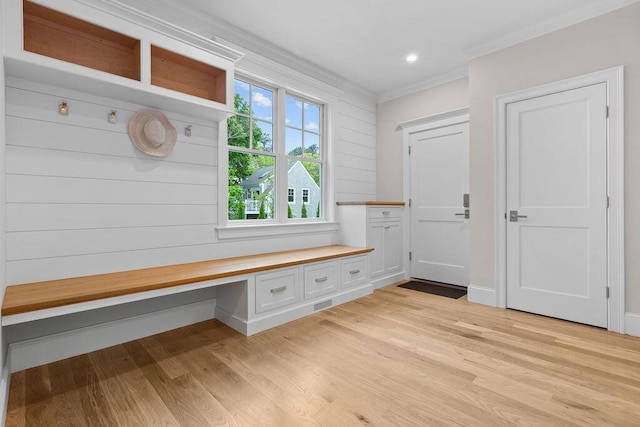 64 Pershing Ln, Orleans, MA 02653 - mudroom featuring crown molding, light wood-type flooring, built in study area, and recessed lighting