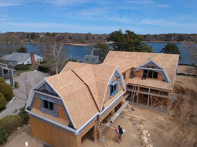 birds eye view of property featuring a water view