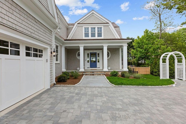 64 Pershing Ln, Orleans, MA 02653 - view of front of house featuring covered porch and a gambrel roof