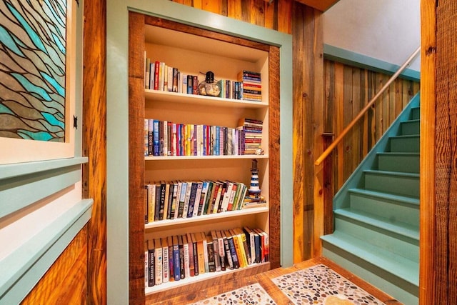 staircase with built in shelves