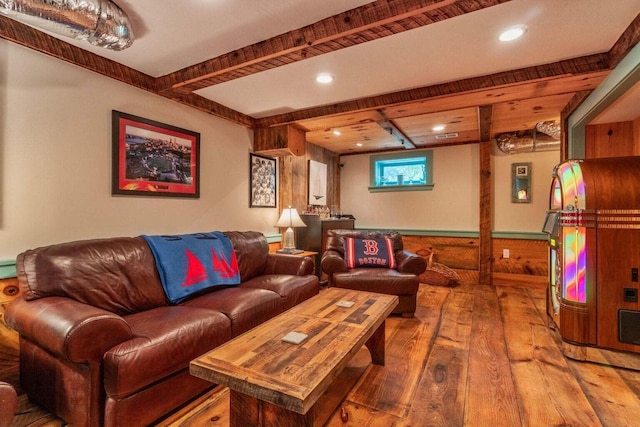 living room featuring hardwood / wood-style floors, beamed ceiling, and recessed lighting