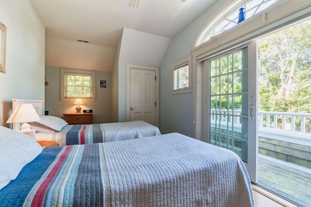 bedroom with access to exterior, visible vents, and vaulted ceiling