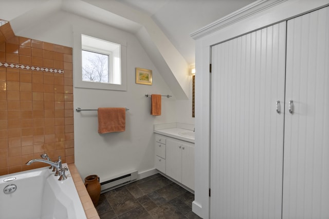 48 Pleasant St Unit U3, Provincetown, MA 02657 - bathroom with baseboard heating, vanity, a bath, and stone finish flooring