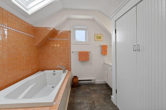 48 Pleasant St Unit U3, Provincetown, MA 02657 - bathroom featuring vanity, a relaxing tiled tub, a skylight, a baseboard radiator, and stone finish floors