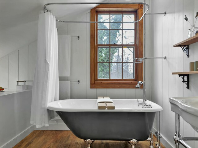 bathroom with wood-type flooring