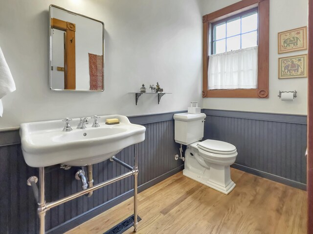 bathroom featuring sink, hardwood / wood-style floors, and toilet