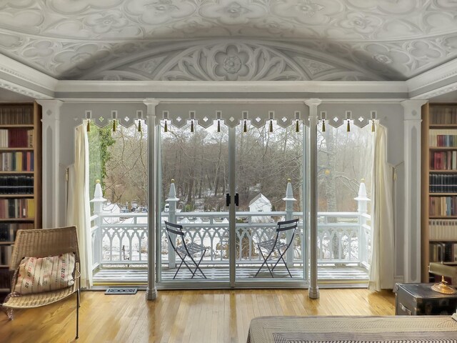 entryway featuring crown molding and wood-type flooring