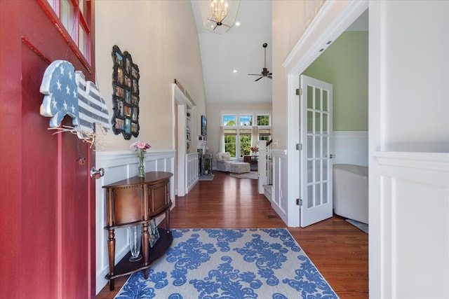 101 Pheasant Hill Cir, Cotuit, MA 02635 - entryway with wainscoting, wood finished floors, a chandelier, a ceiling fan, and high vaulted ceiling