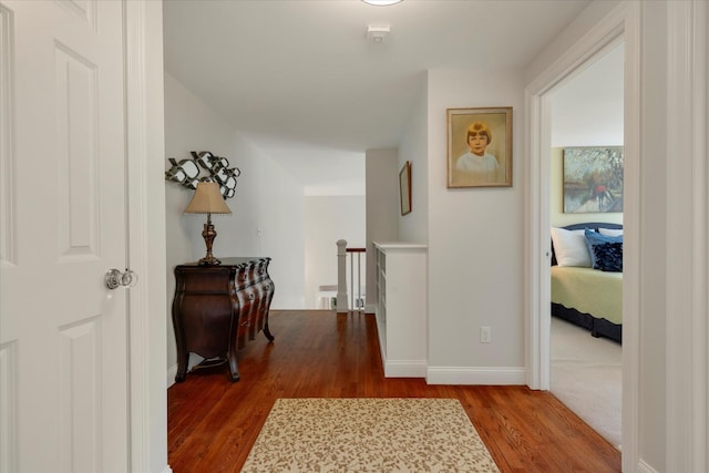 101 Pheasant Hill Cir, Cotuit, MA 02635 - hall featuring an upstairs landing and dark wood-style floors