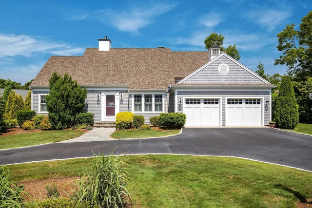 101 Pheasant Hill Cir, Cotuit, MA 02635 - view of front facade featuring driveway, an attached garage, a front lawn, and a chimney