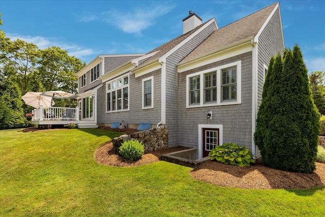 101 Pheasant Hill Cir, Cotuit, MA 02635 - rear view of house with a deck, a lawn, a chimney, and a shingled roof