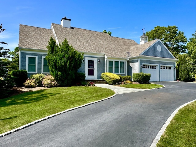 101 Pheasant Hill Cir, Cotuit, MA 02635 - view of front of home featuring an attached garage, asphalt driveway, roof with shingles, and a front lawn