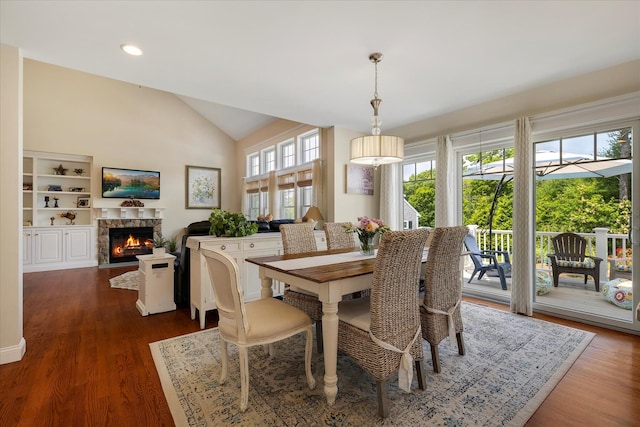 101 Pheasant Hill Cir, Cotuit, MA 02635 - dining space with a fireplace with flush hearth, lofted ceiling, dark wood-type flooring, and recessed lighting