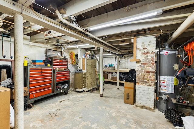 104R Homes Ave, Boston, MA 02123 - unfinished basement with water heater and a workshop area