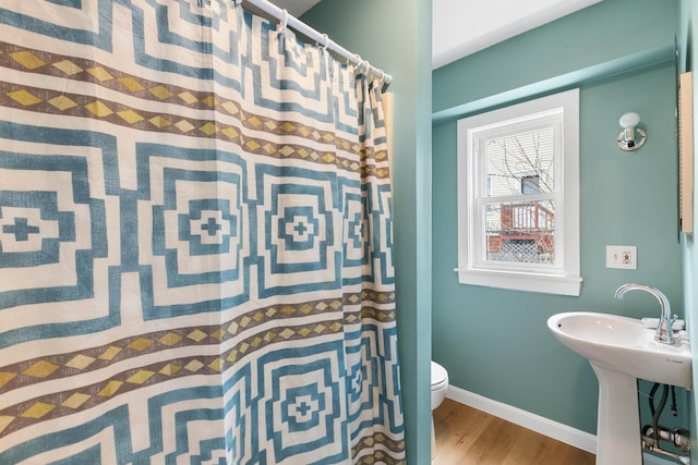 104R Homes Ave, Boston, MA 02123 - bathroom featuring wood finished floors, toilet, a sink, baseboards, and a shower with curtain