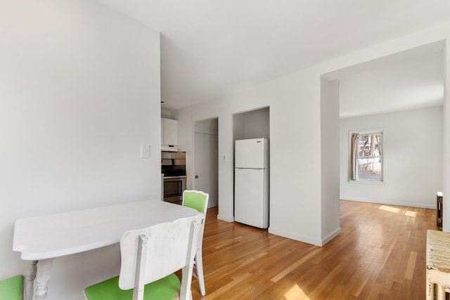 104R Homes Ave, Boston, MA 02123 - dining room with light wood-style floors and baseboards