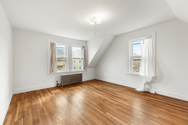 104R Homes Ave, Boston, MA 02123 - bonus room featuring radiator, wood finished floors, lofted ceiling, and baseboards