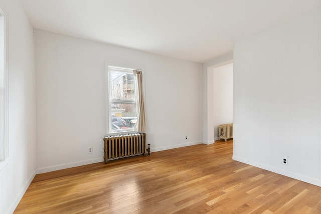 104R Homes Ave, Boston, MA 02123 - unfurnished room with radiator, light wood-type flooring, and baseboards