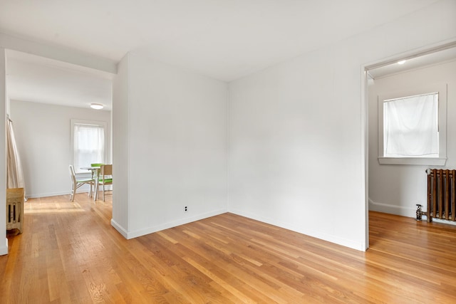 104R Homes Ave, Boston, MA 02123 - spare room with radiator heating unit, light wood finished floors, and baseboards
