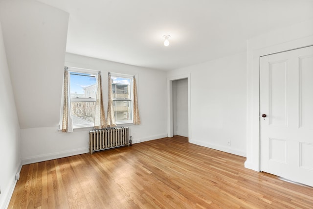 104R Homes Ave, Boston, MA 02123 - unfurnished bedroom featuring radiator heating unit, baseboards, and light wood-style floors