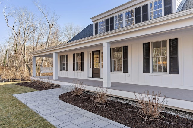 doorway to property featuring covered porch