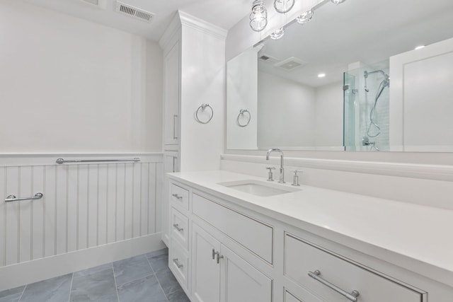 bathroom featuring walk in shower, vanity, and tile patterned flooring