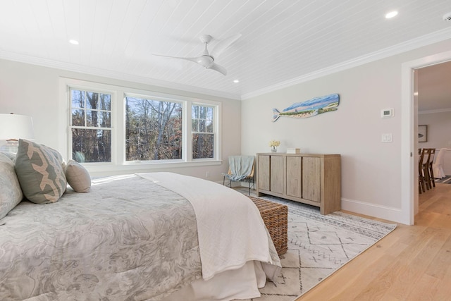 bedroom featuring crown molding, wooden ceiling, light hardwood / wood-style flooring, and ceiling fan