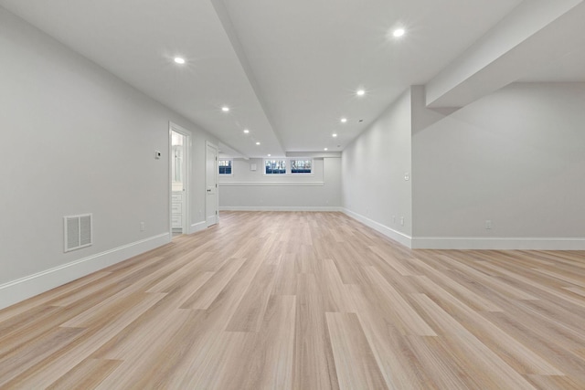 unfurnished living room featuring light wood-type flooring