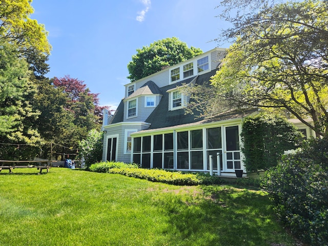 250 Scraggy Neck Rd, Cataumet, MA 02534 - back of house with a sunroom and a yard