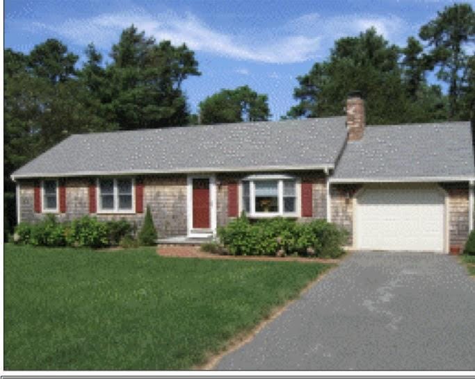 12 Pine Ter, East Sandwich, MA 02537 - ranch-style home featuring an attached garage, asphalt driveway, a front yard, and a chimney