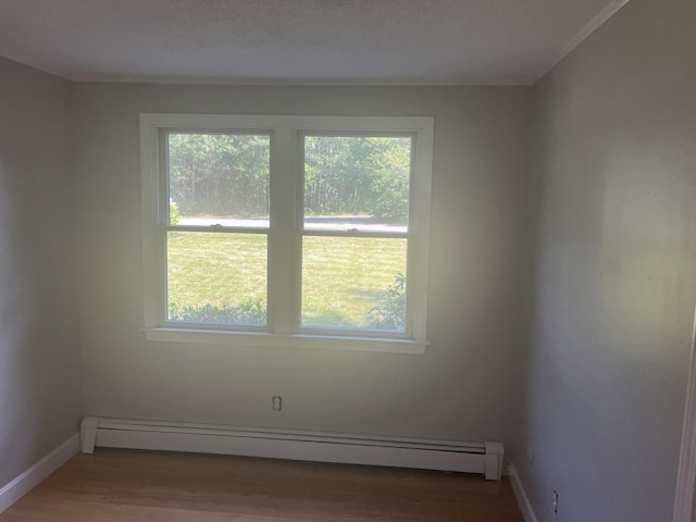 12 Pine Ter, East Sandwich, MA 02537 - unfurnished room featuring a baseboard heating unit and wood finished floors
