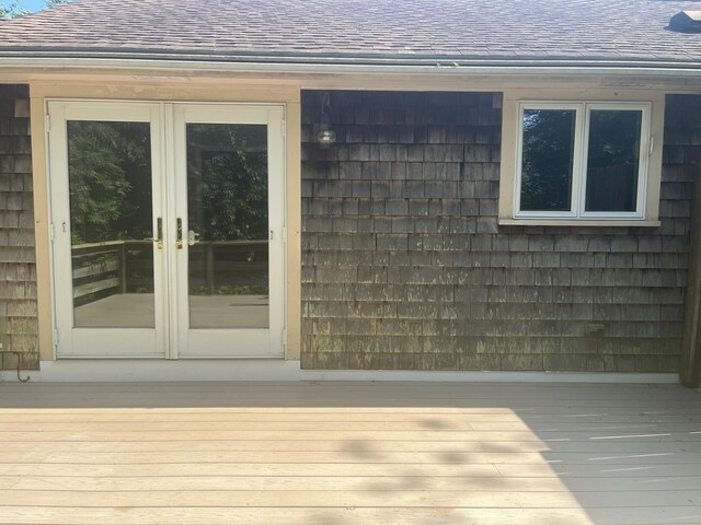 12 Pine Ter, East Sandwich, MA 02537 - view of exterior entry with roof with shingles and french doors