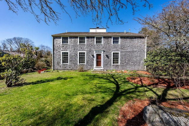 11 Allyn Ln, Barnstable, MA 02630 - view of front of home with a chimney and a front lawn